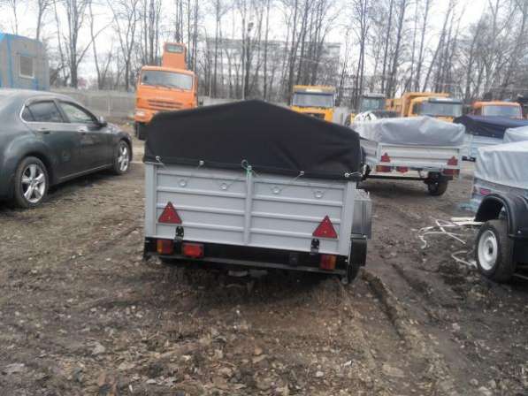 Прицеп для легкового автомобиля с V образным дышлом 2150х1300 с тентом и дугами в Москве фото 4